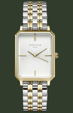 Rosefield women's two-tone stainless steel and gold watch with a rectangular bezel, white dial, and integrated link bracelet.