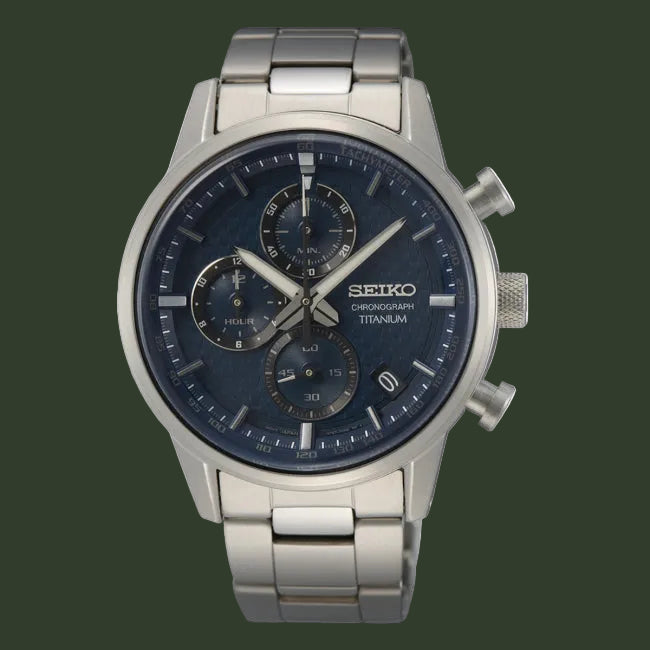 A Seiko chronograph watch with a silver stainless steel case and link bracelet, featuring a dark blue dial with three subdials and silver-tone hands and markers.