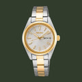 Two-tone Seiko watch with silver and gold band on a white background