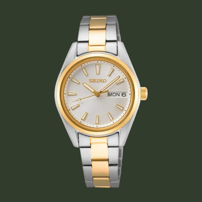 Two-tone Seiko watch with silver and gold band on a white background