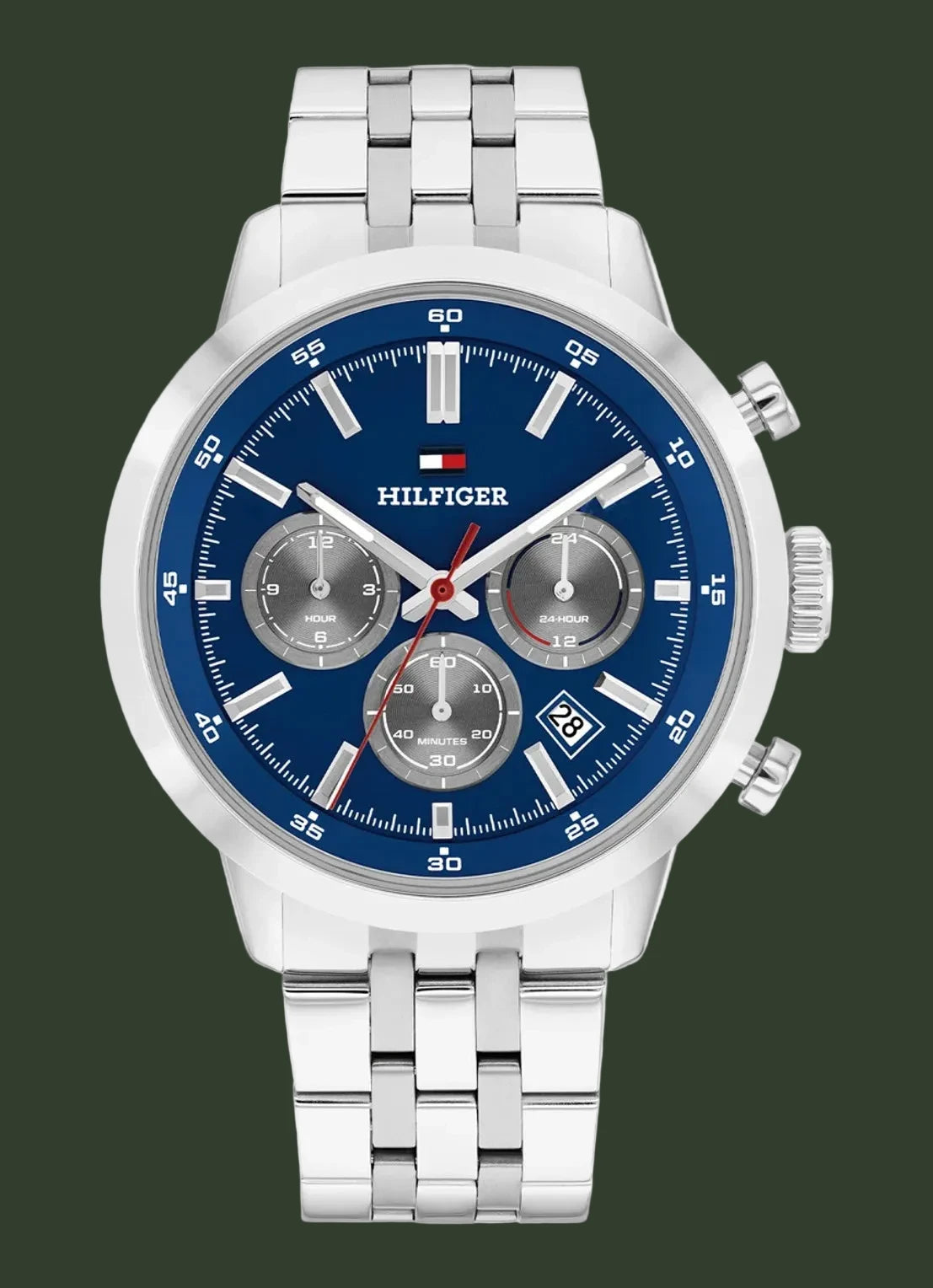 A Tommy Hilfiger men's chronograph watch with a silver stainless steel case and link bracelet, featuring a blue dial with silver subdials and markers.