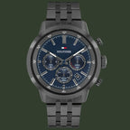 Tommy Hilfiger watch with dark blue face and black metal strap on a white background