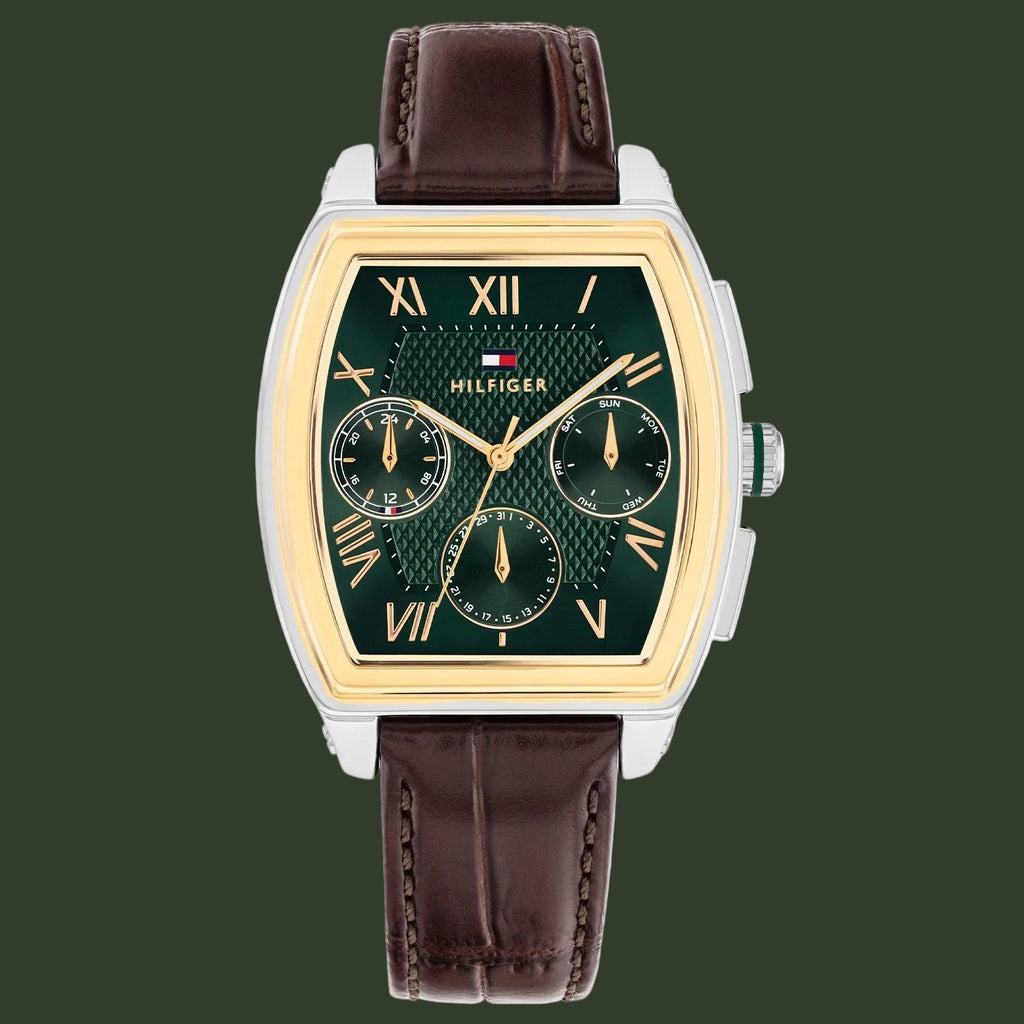 Tommy Hilfiger watch with green face and brown leather strap on white background