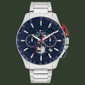 Tommy Hilfiger watch with a blue face and silver band on a white background