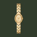 Michael Kors gold-tone oval watch with a matching metal link bracelet, shown against a plain white background.
