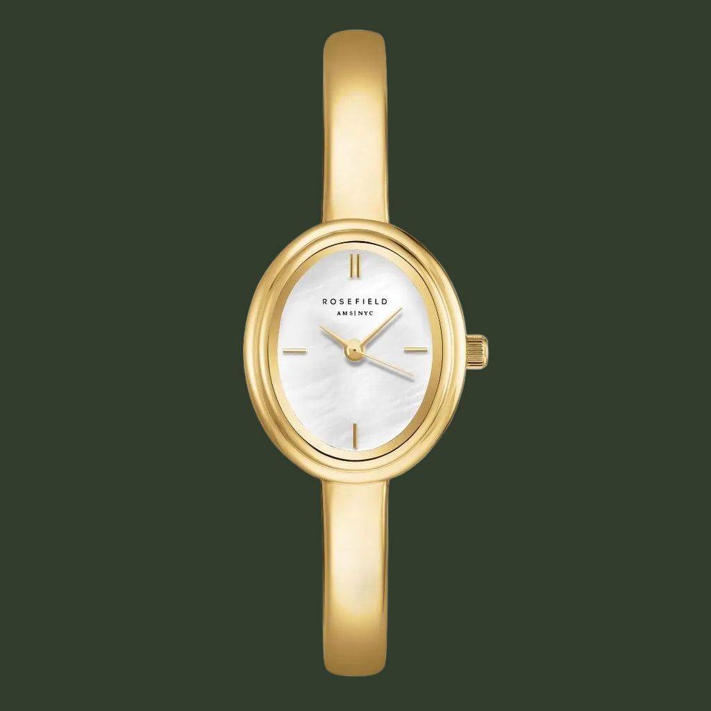 Gold watch with a white face on a white background