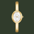 Gold watch with a white face on a white background