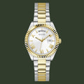 Two-tone watch with gold and silver band on a white background