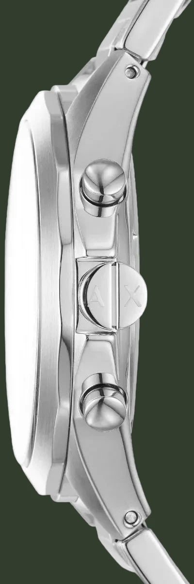 Close-up of a silver watch with detailed design on a white background